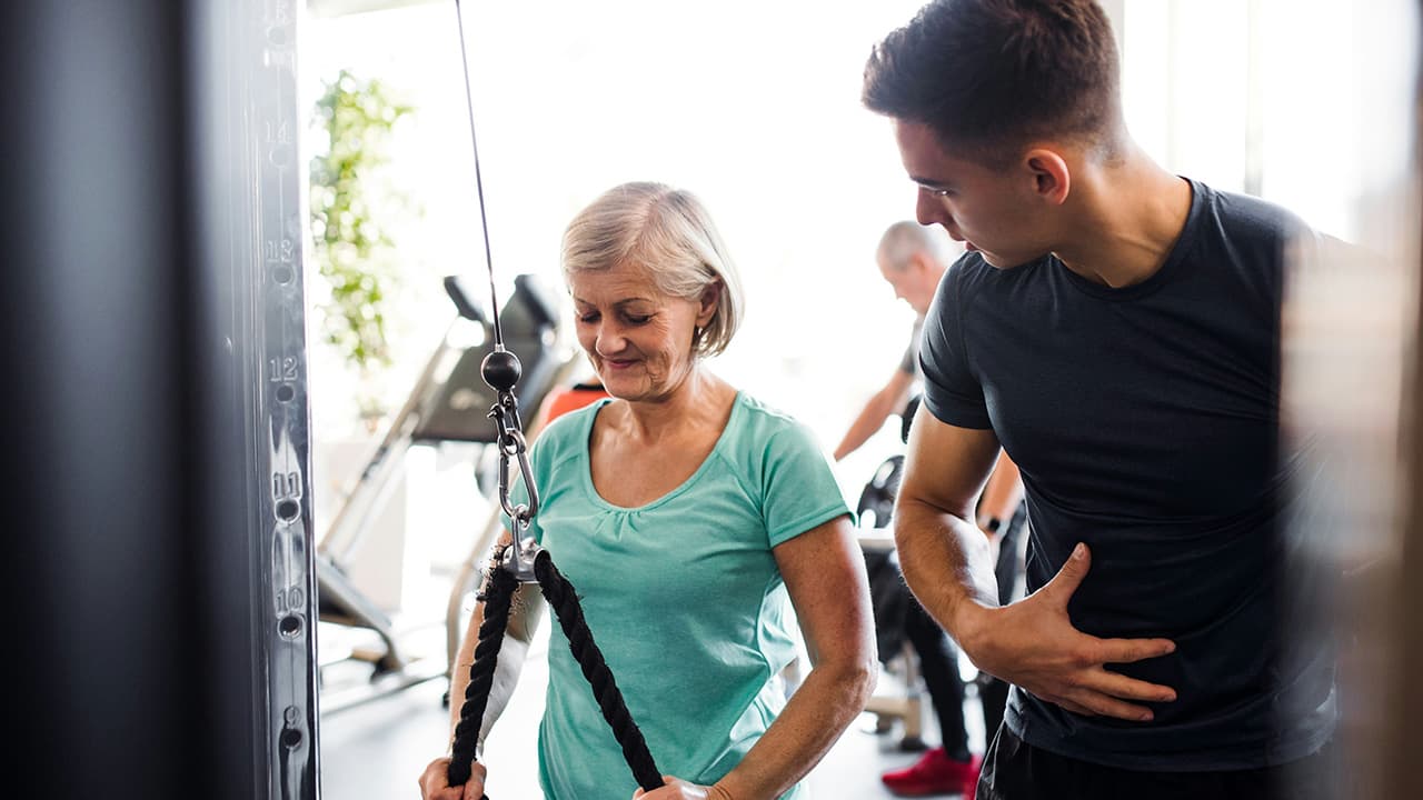 Personal trainer working with a client during a training session