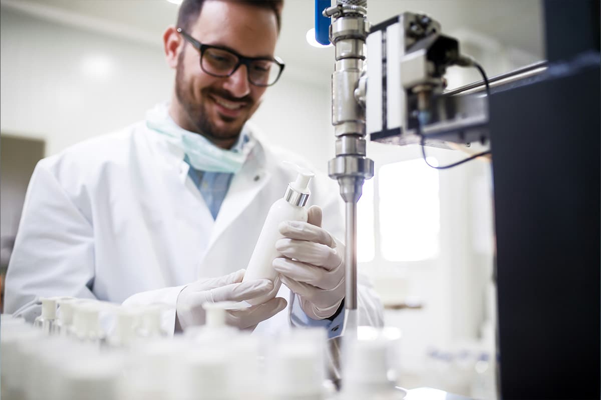 Pharmacist preparing medication behind a counter