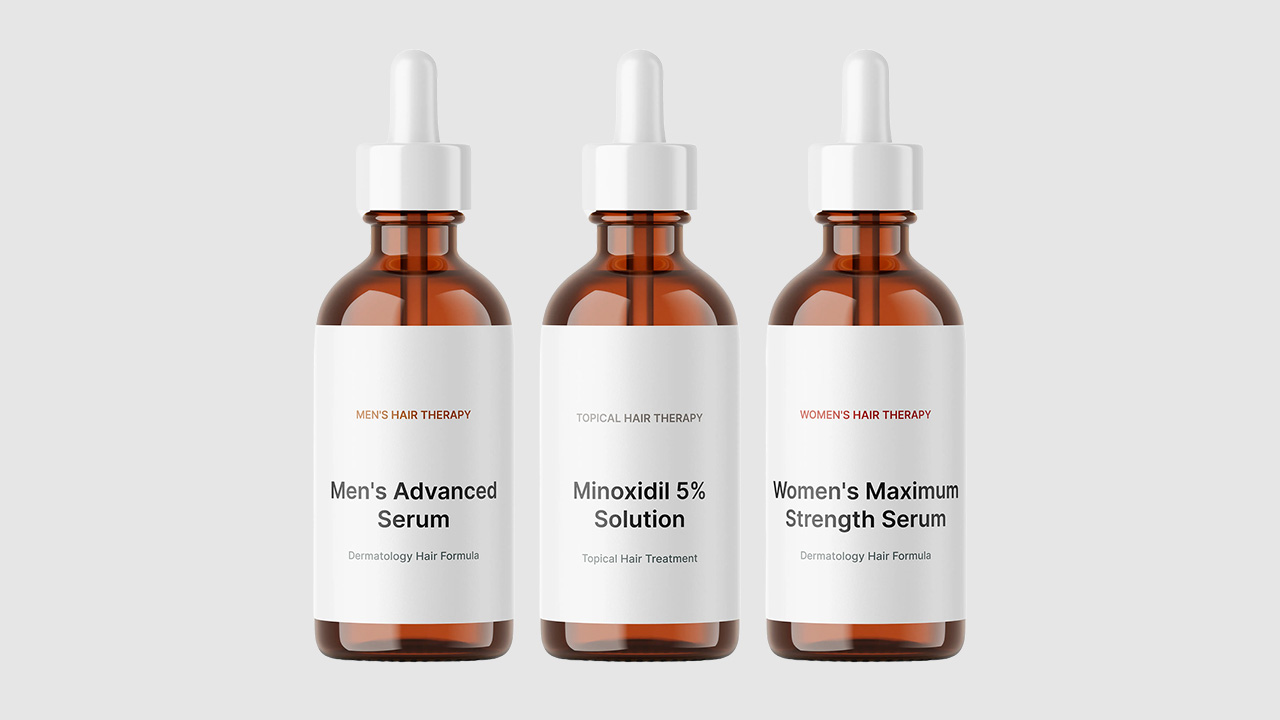 Hair therapy serum bottles including men's advanced serum, minoxidil solution, and women's maximum strength serum